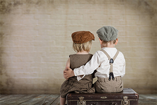 two kids waiting for a train