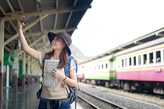 a teenager waiting for a train